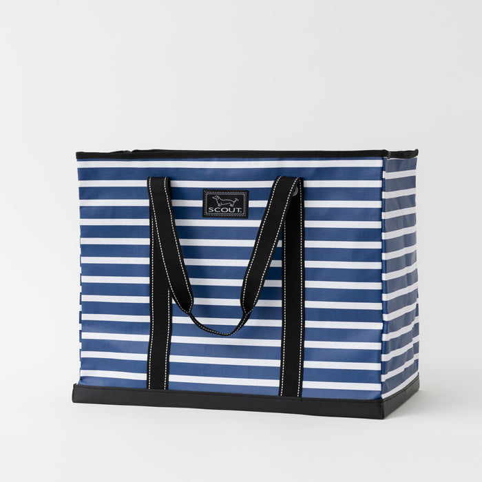 Blue and white striped tote bag with black handles on a light gray background