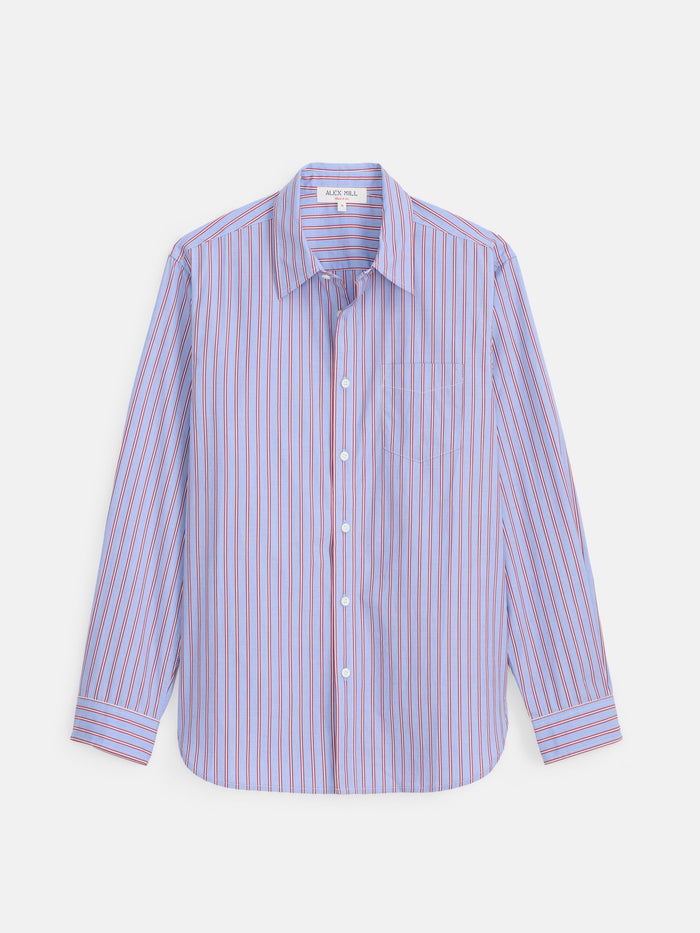 The Mill Point Collar Striped Shirt in Cotton Poplin is a long-sleeve, button-up shirt crafted from blue garment-dyed cotton poplin featuring red vertical stripes, a single chest pocket, and a classic point collar, displayed flat on a white background.