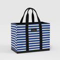Blue and white striped tote bag with black handles on a light gray background