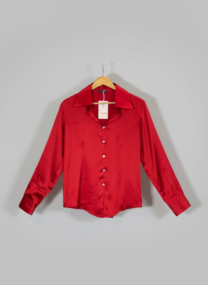 Red shirt on a hanger against a red and white background