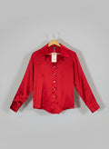 Red shirt on a hanger against a red and white background