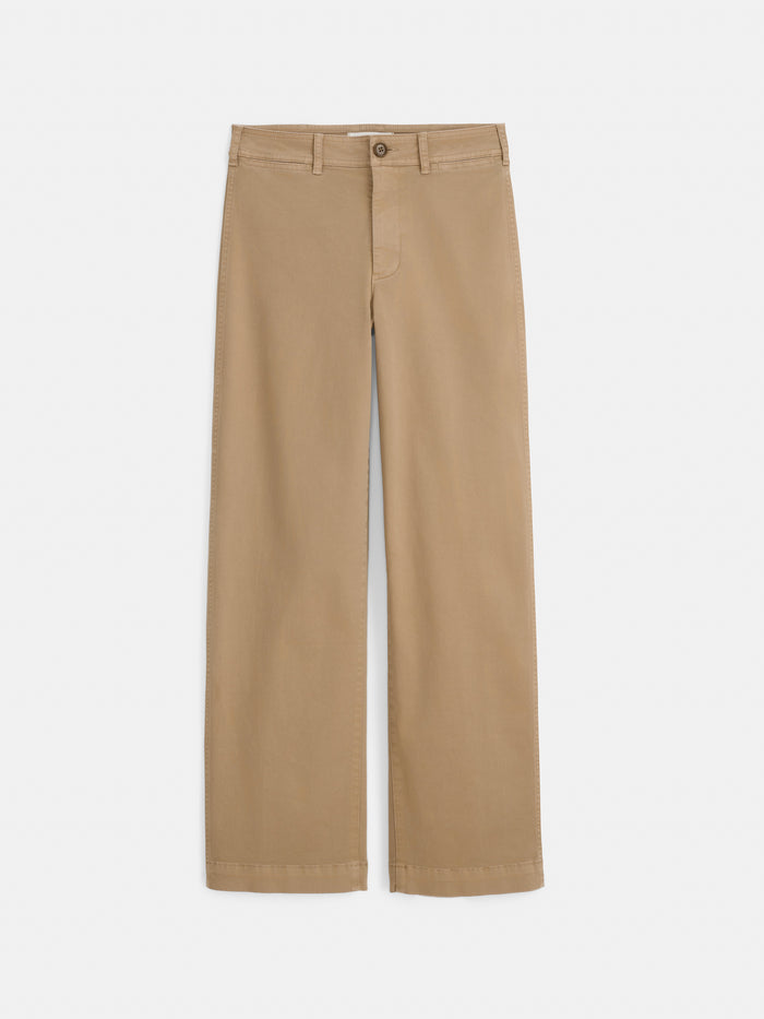 The Sutton Pant in Vintage Twill features a beige high-rise straight-leg silhouette with belt loops, a front button, and zipper closure, shown flat against a white background.